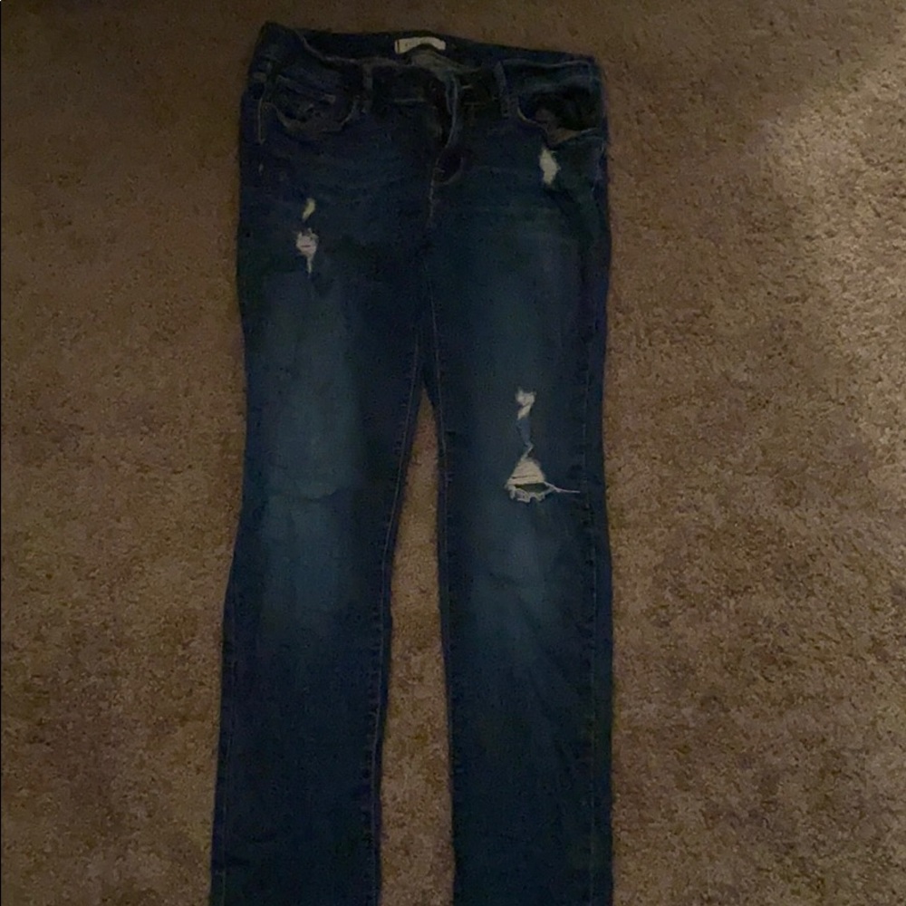 Straight leg dark wash ripped jeans